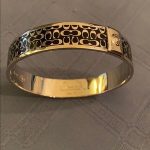 AUTHENTIC COACH SIGNATURE BLACK AND SILVER BANGLE